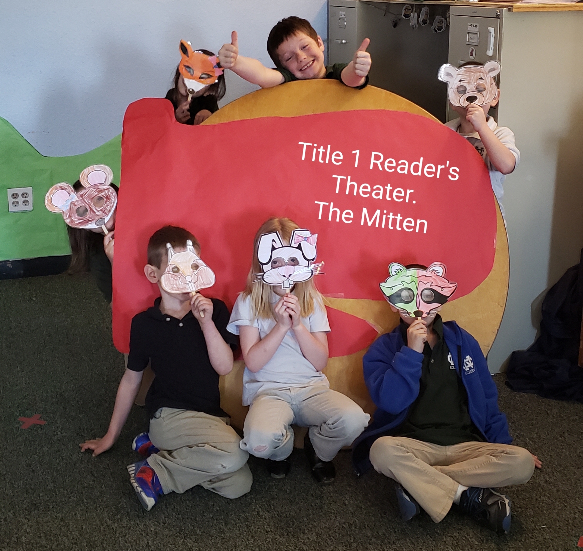 The cast of the reader theater with their finished masks