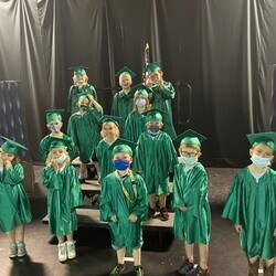 Seven kinder children in grad gear