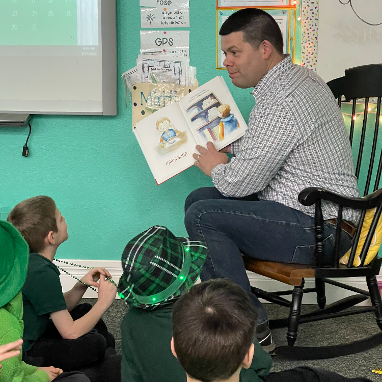Cole reading to students